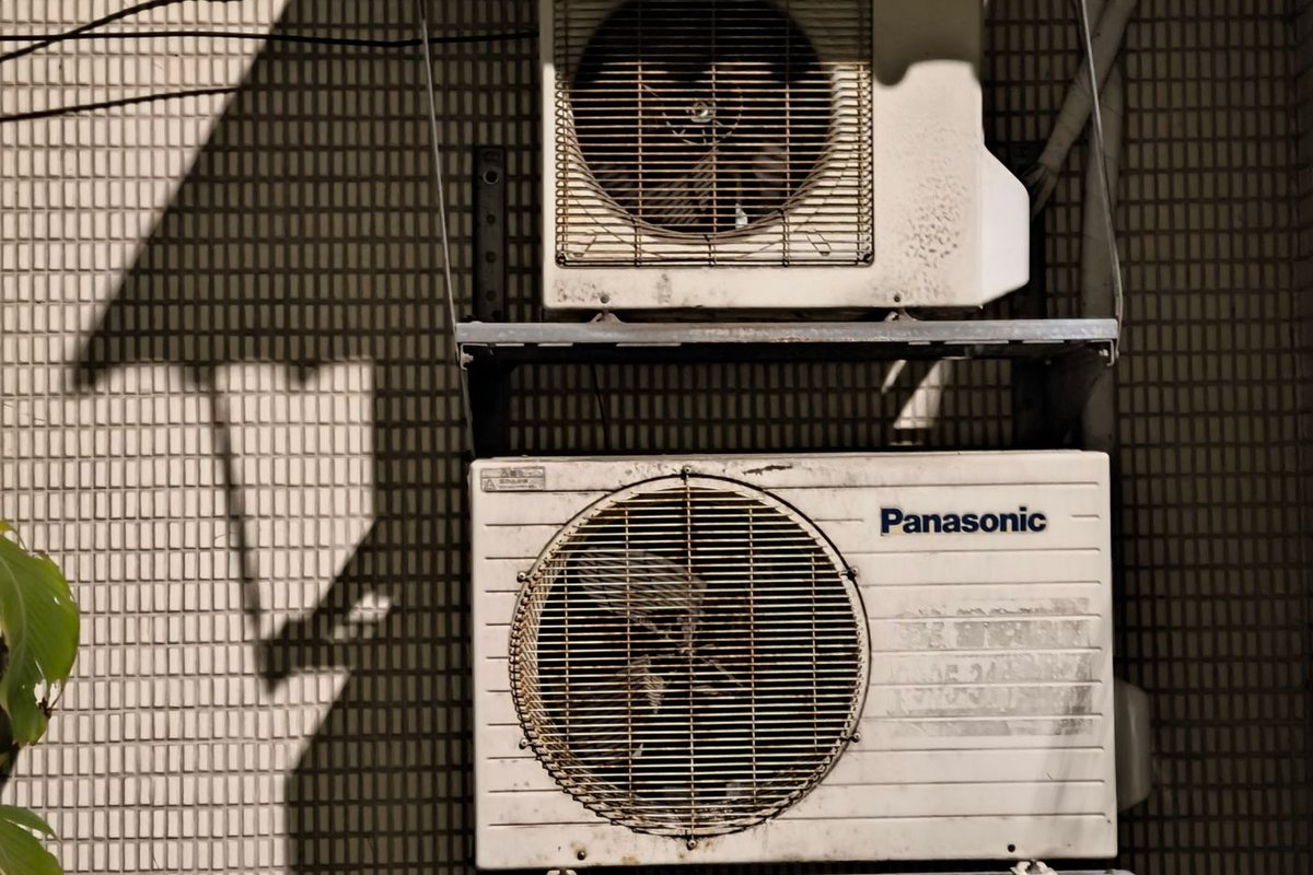 Outdoor air conditioner condenser units in the hot sun
